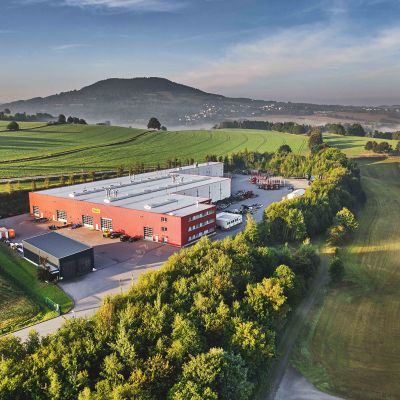 Aerial view of the DOLL plant in Mildenau, in a misty valley in the Black Forest